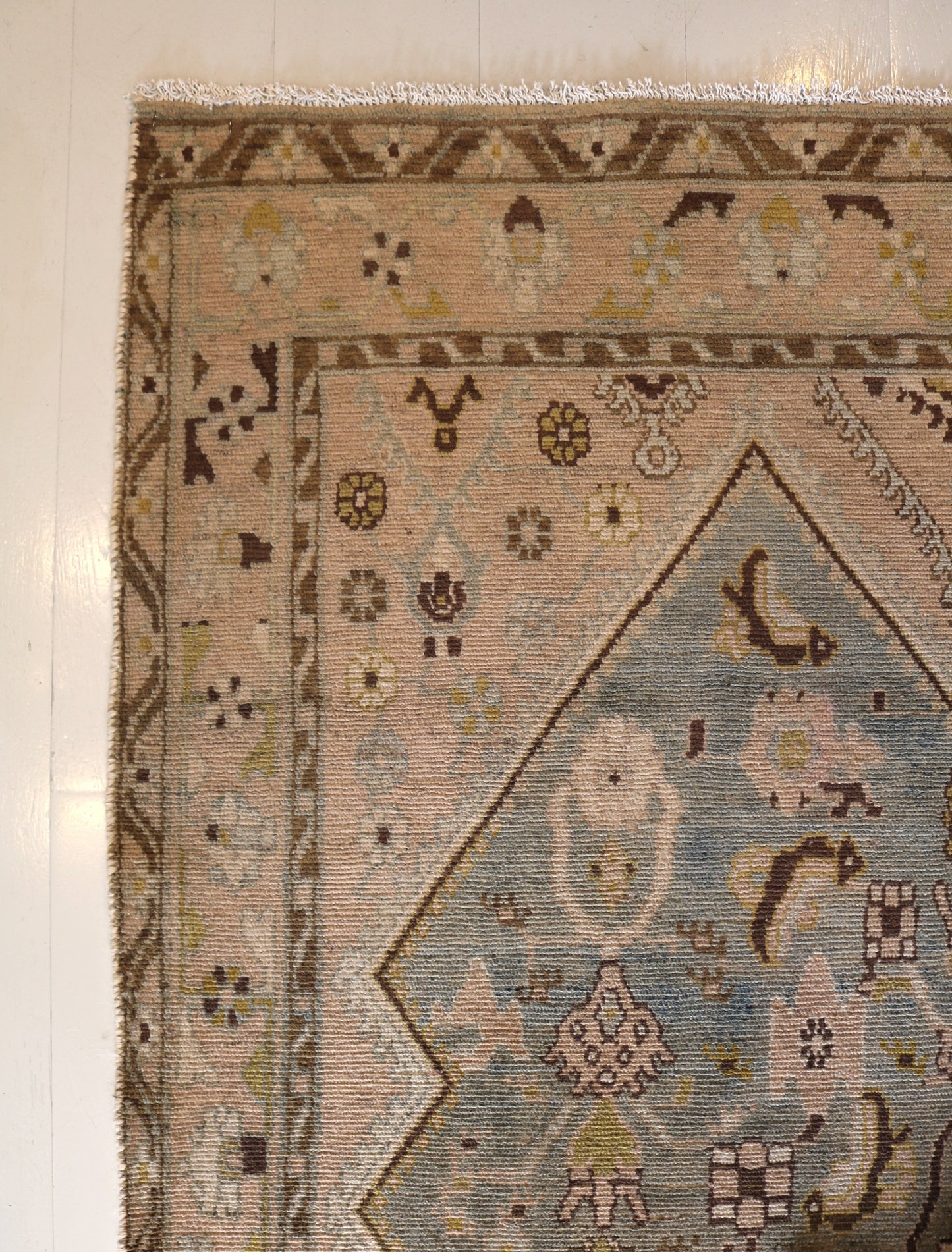 Malayer with muted colours and light blue centre