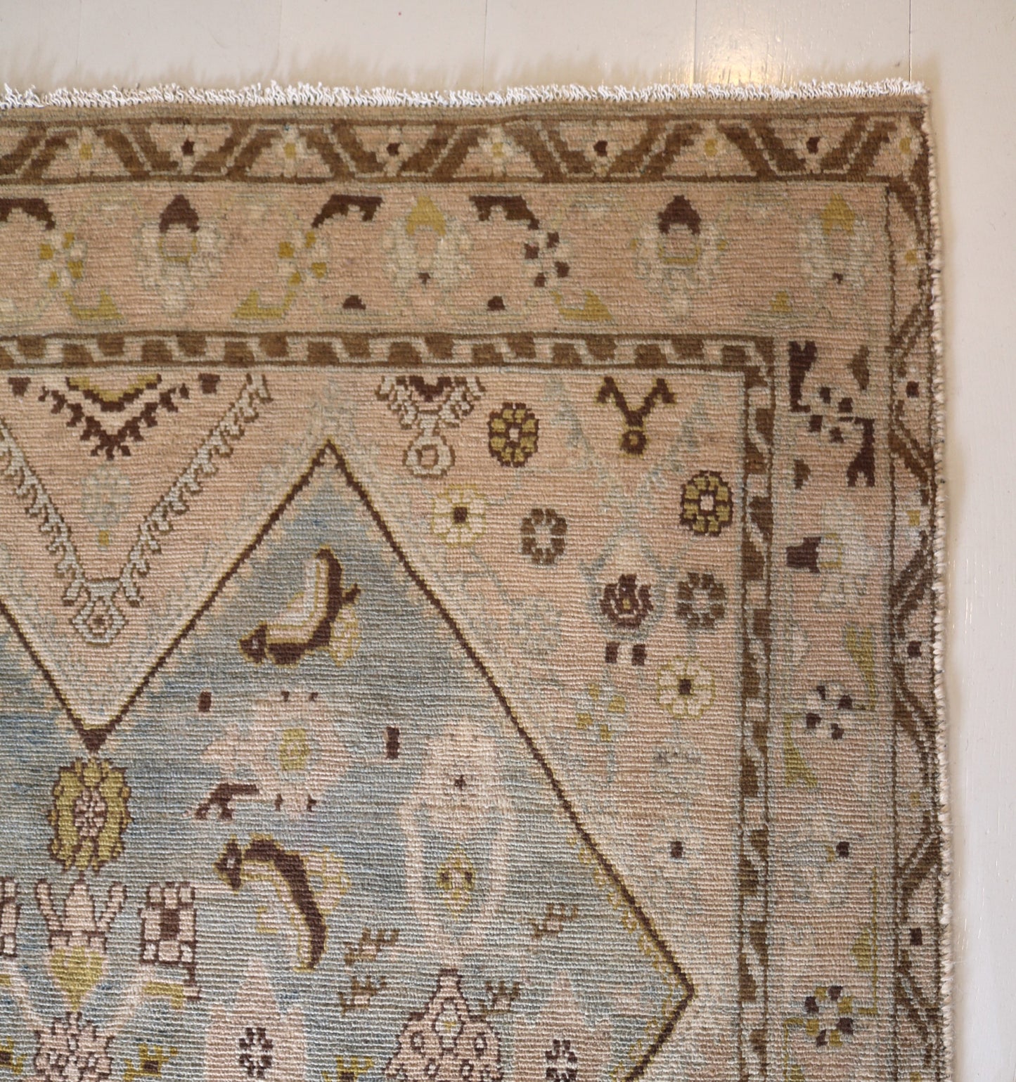 Malayer with muted colours and light blue centre