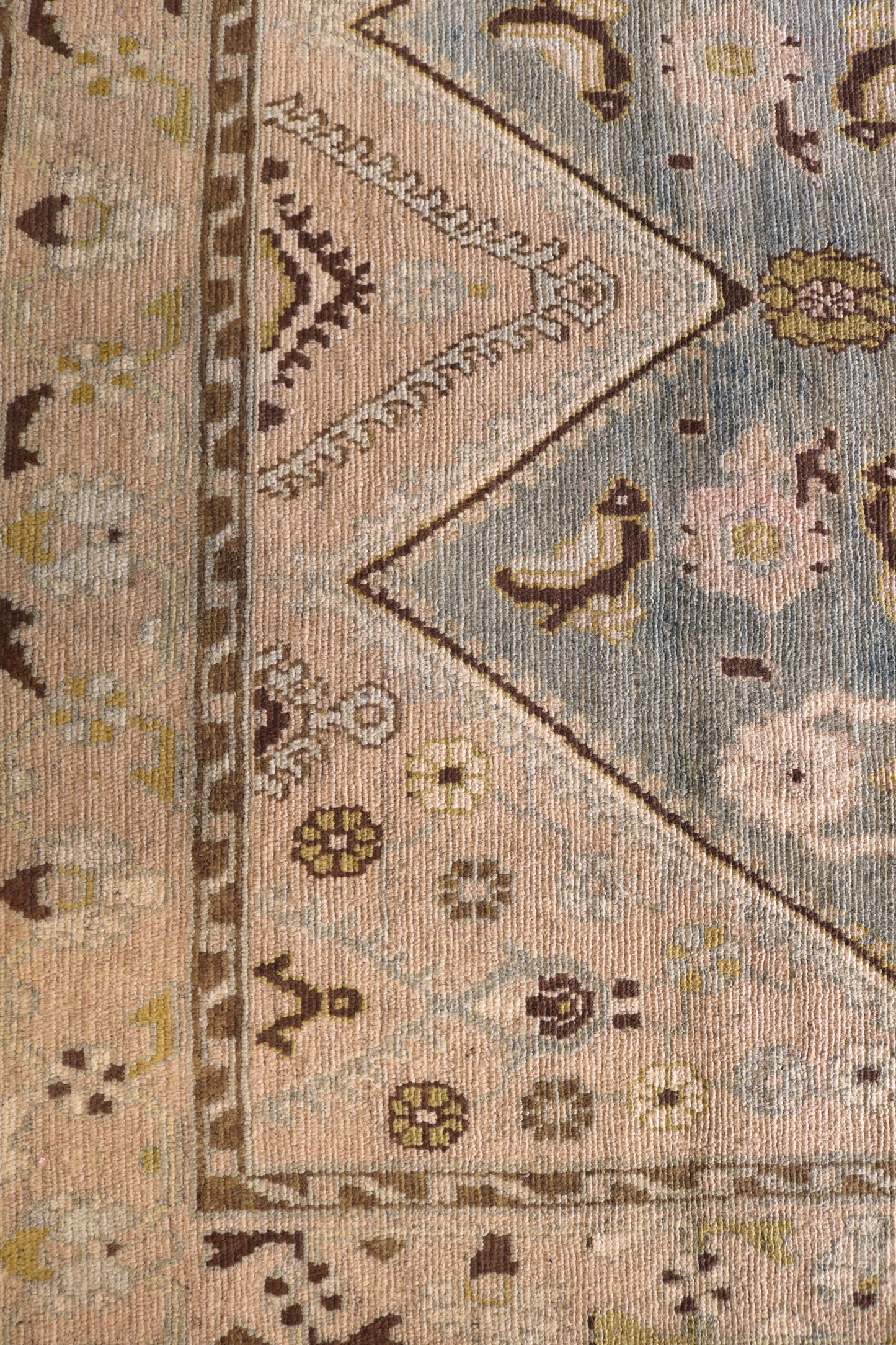 Malayer with muted colours and light blue centre