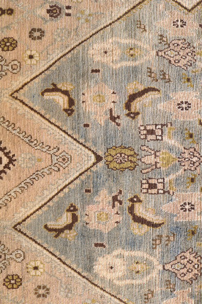 Malayer with muted colours and light blue centre