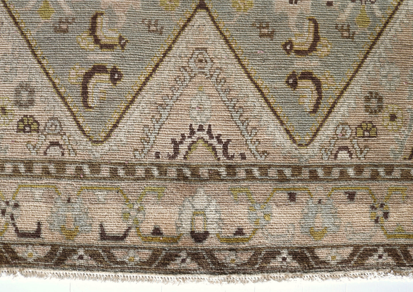 Malayer with muted colours and light blue centre