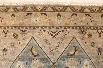 Malayer with muted colours and light blue centre